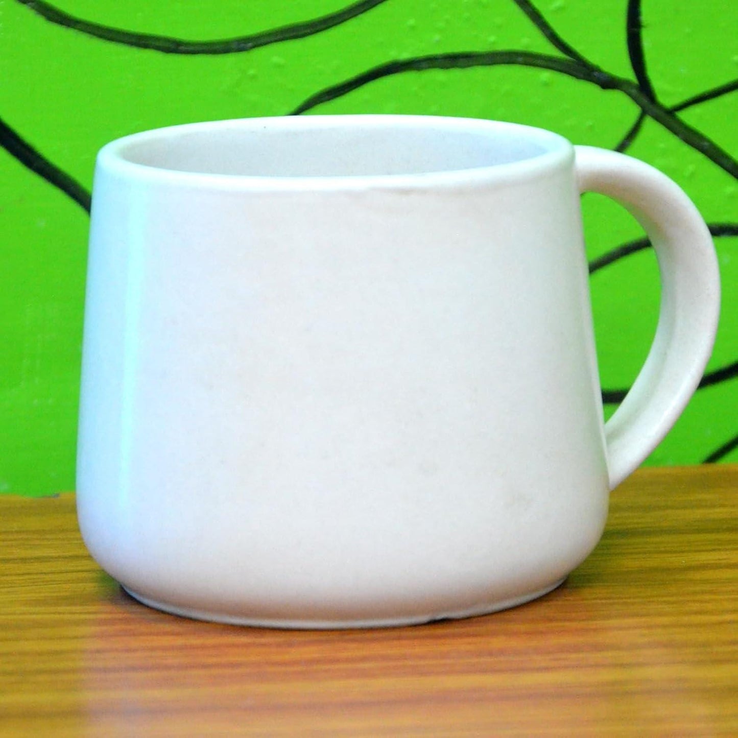 Black Ceramic Coffee Mug with Copper Handle: The Earth Store