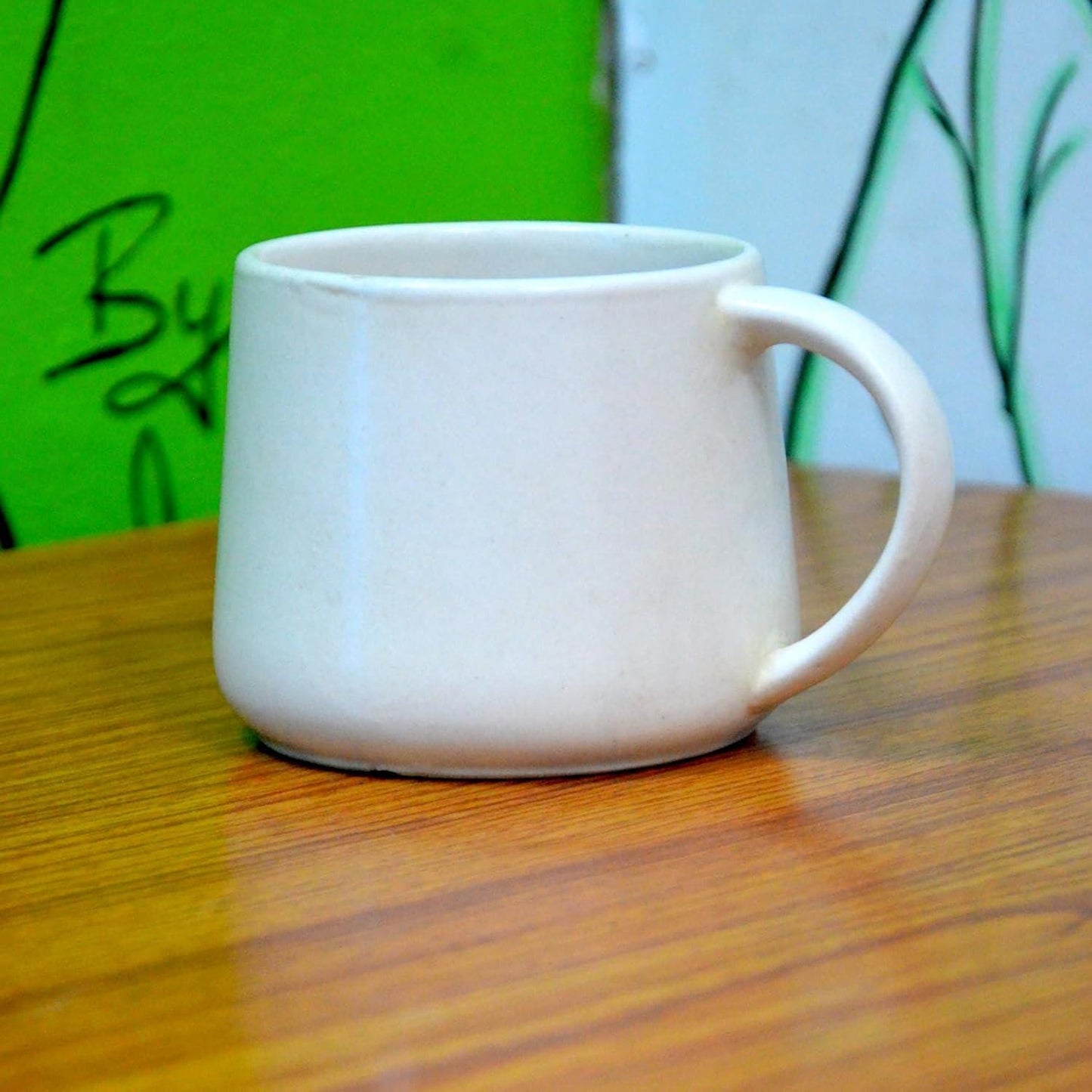 Black Ceramic Coffee Mug with Copper Handle: The Earth Store
