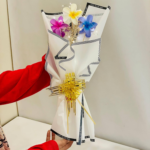 Clutcher Bouquet with Mixed Color clutcher, White Paper Wrap, Gold Ribbon, I Love You Message Border for Romantic Gifting - Image 2